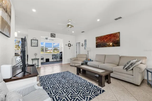 a living room with furniture and a rug