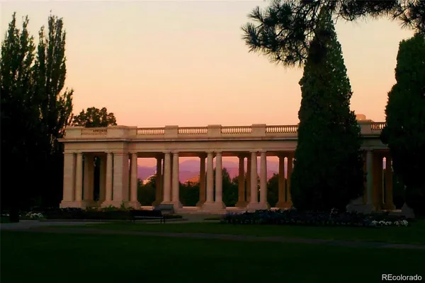 a view of house with swimming pool and garden