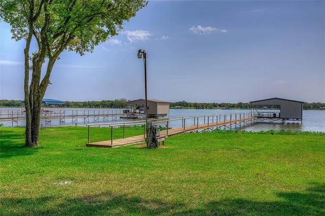 a view of a garden with a lake view