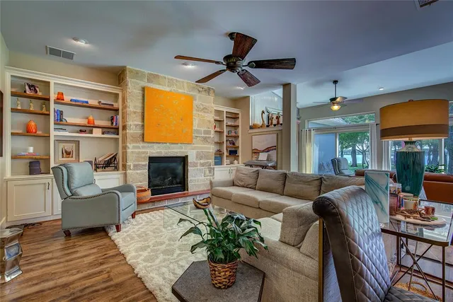 a living room with furniture fireplace and a flat screen tv