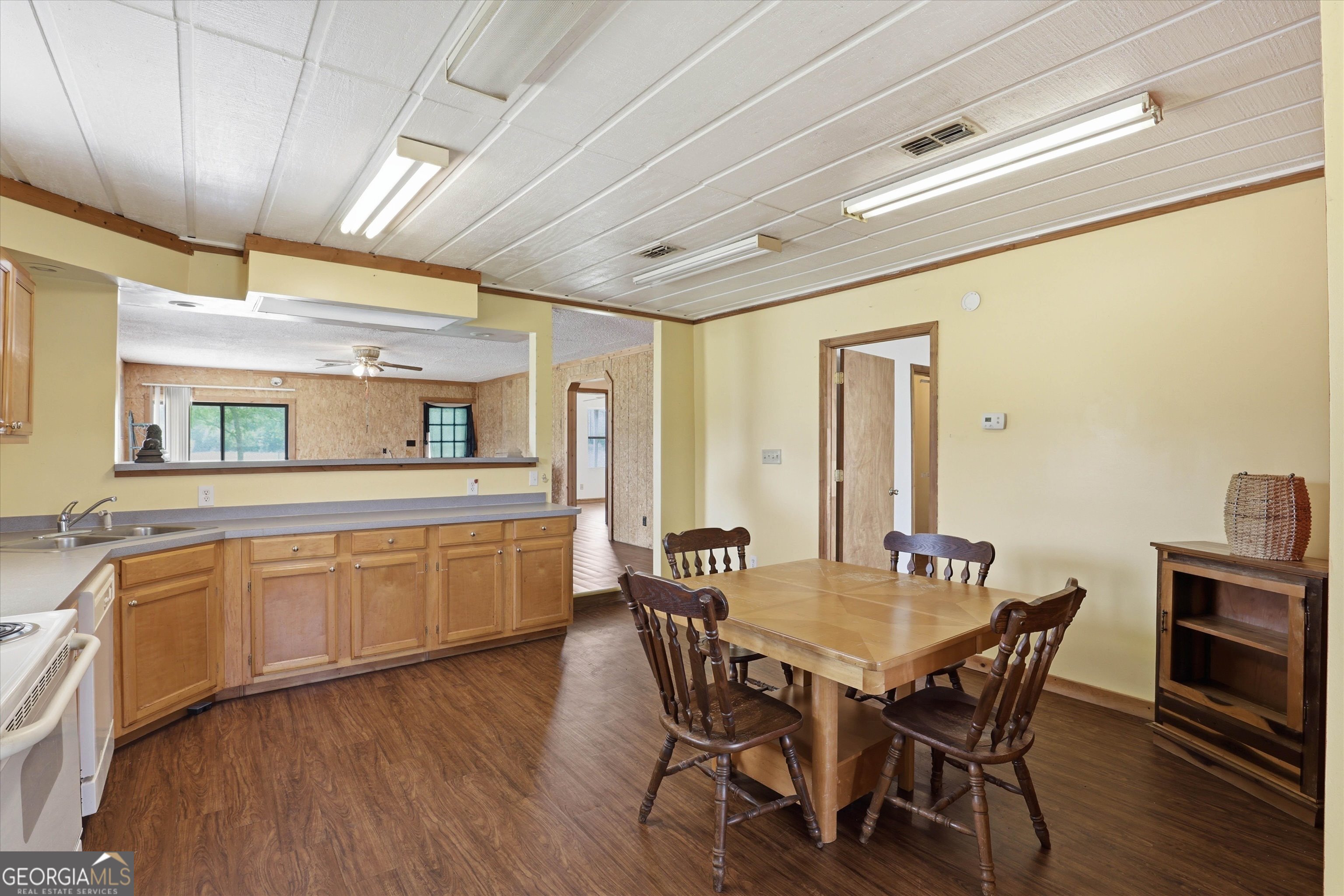 1525 Myron Hart Road Coolidge, GA 31738 - Photo 16 of 58 a view of a dining room with furniture window and wooden floor