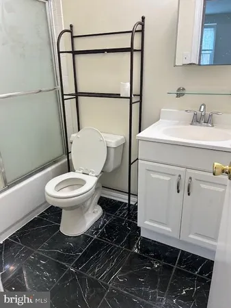 a bathroom with a toilet and a sink