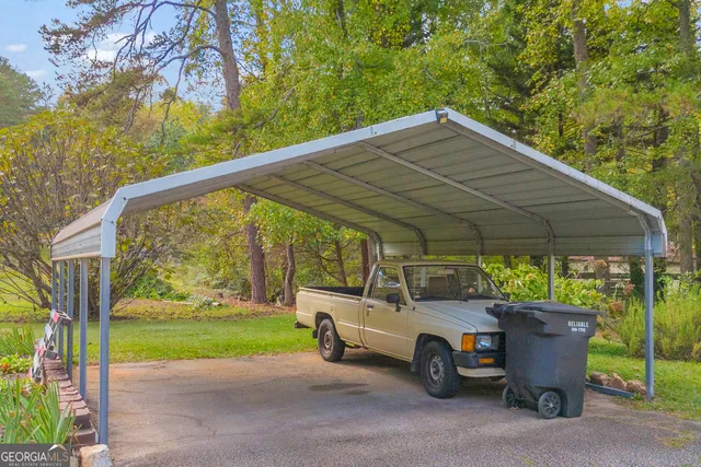 a view of a pathway with a wrought fence