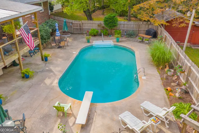 a dining room with furniture a rug and wooden floor