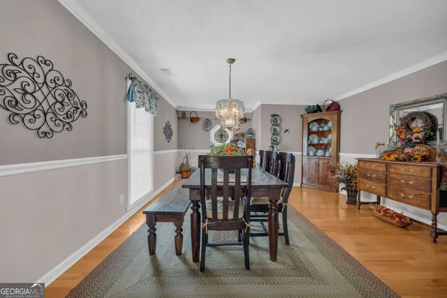 a bedroom with bed and wooden floor