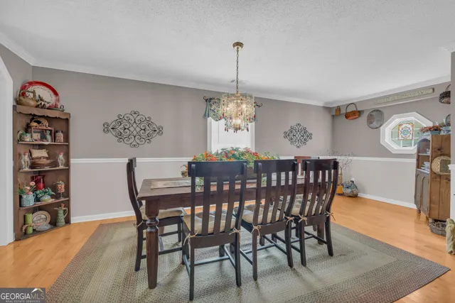 a bathroom with a sink toilet and a mirror