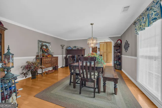 a living room with furniture and a entryway