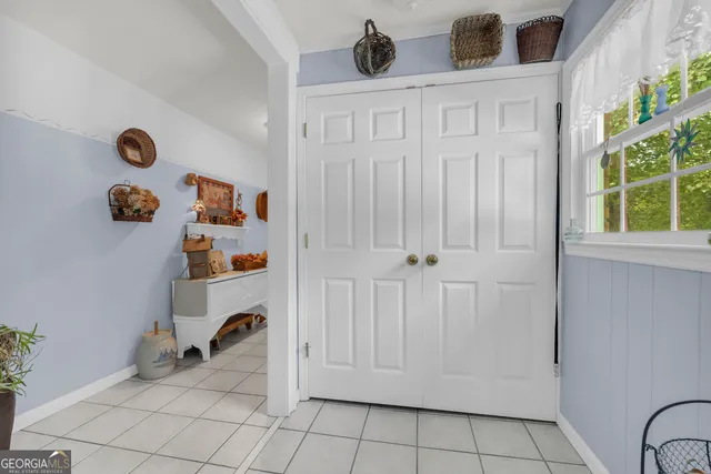 a bathroom with a window and a shower