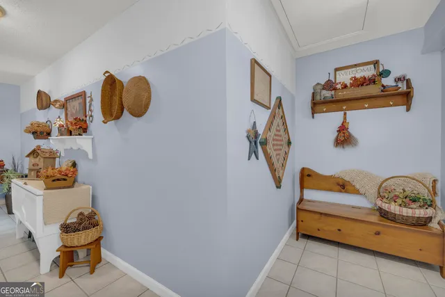 a kitchen with stainless steel appliances kitchen island granite countertop a refrigerator and a stove top oven