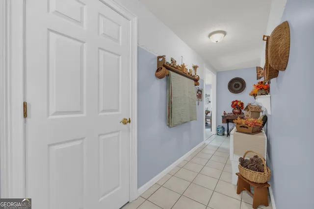a view of kitchen with furniture and refrigerator