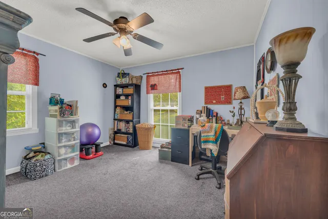 an aerial view of residential houses with outdoor space and swimming pool