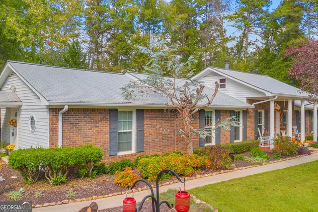 a front view of a house with garden