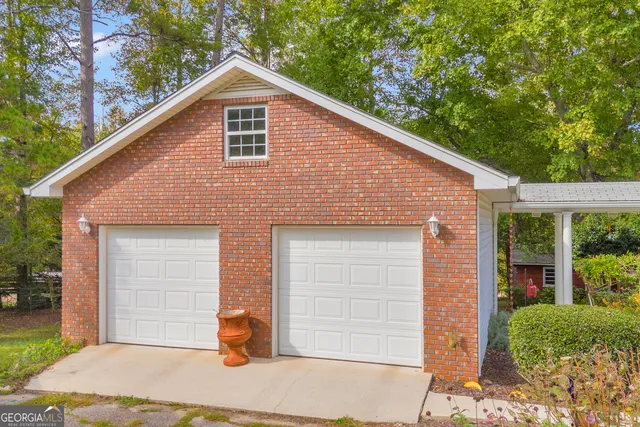 a view of a house with a yard porch and sitting area