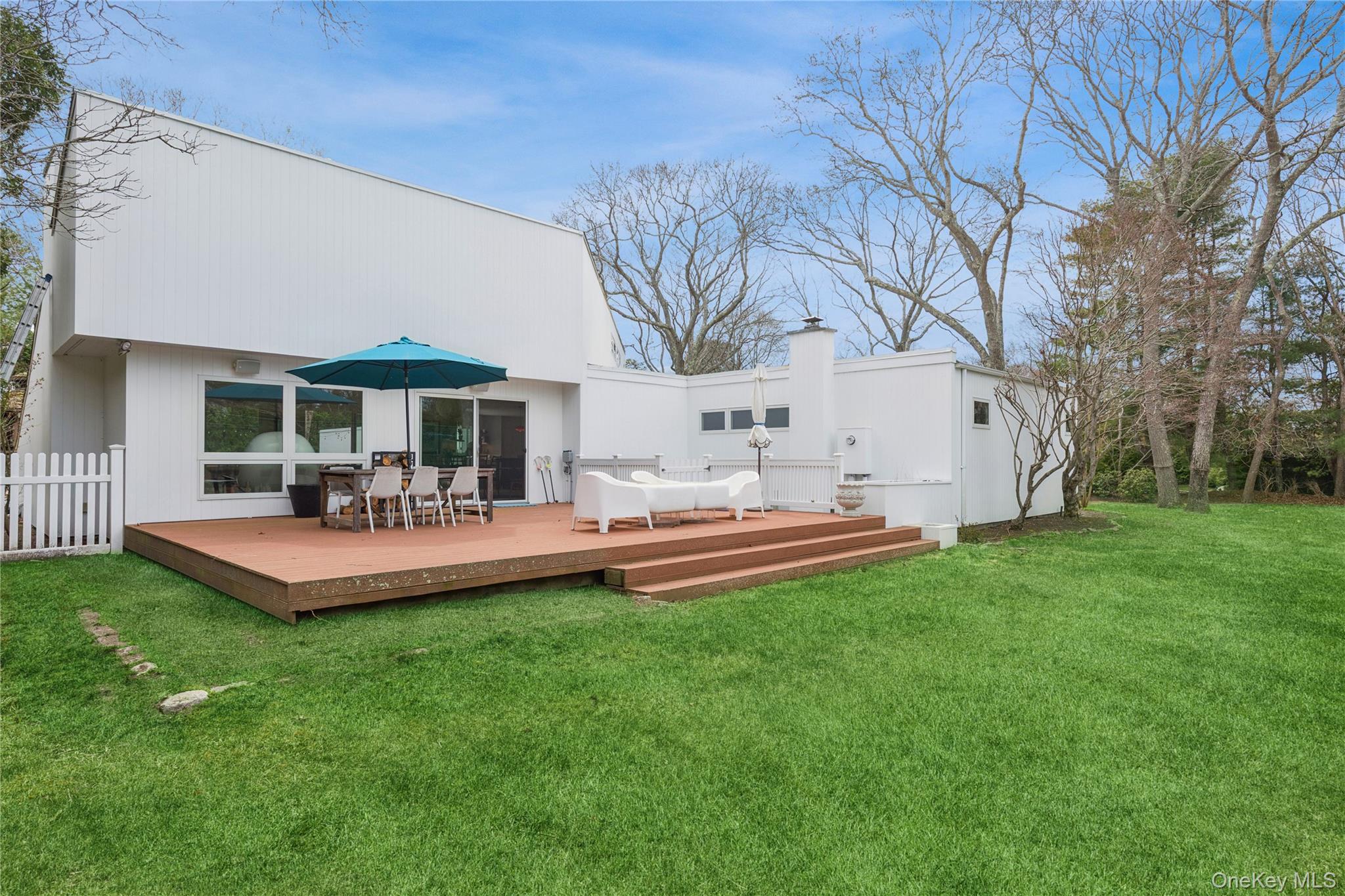2 Acorn Path Quogue, NY 11959 - Photo 16 of 16 Outdoor deck are by tennis court