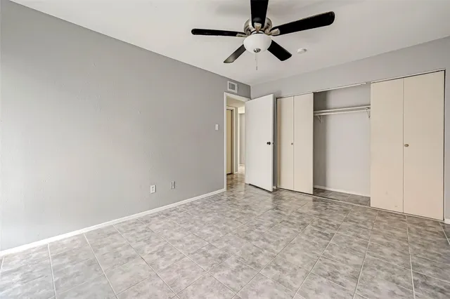 an empty room with fan