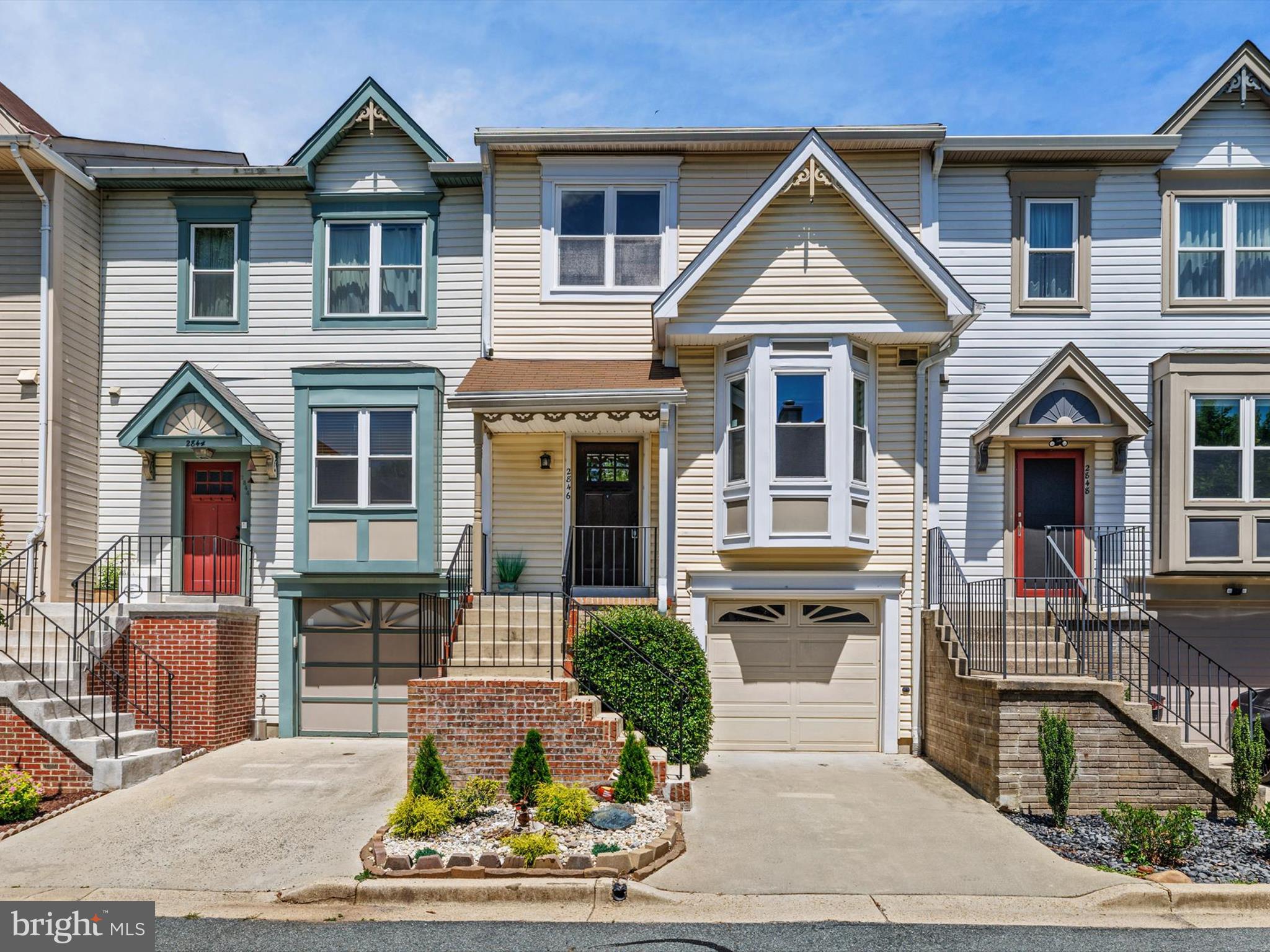 2846 Schoolhouse Circle Silver Spring, MD 20902 - Photo 1 of 32 a front view of a house with garden