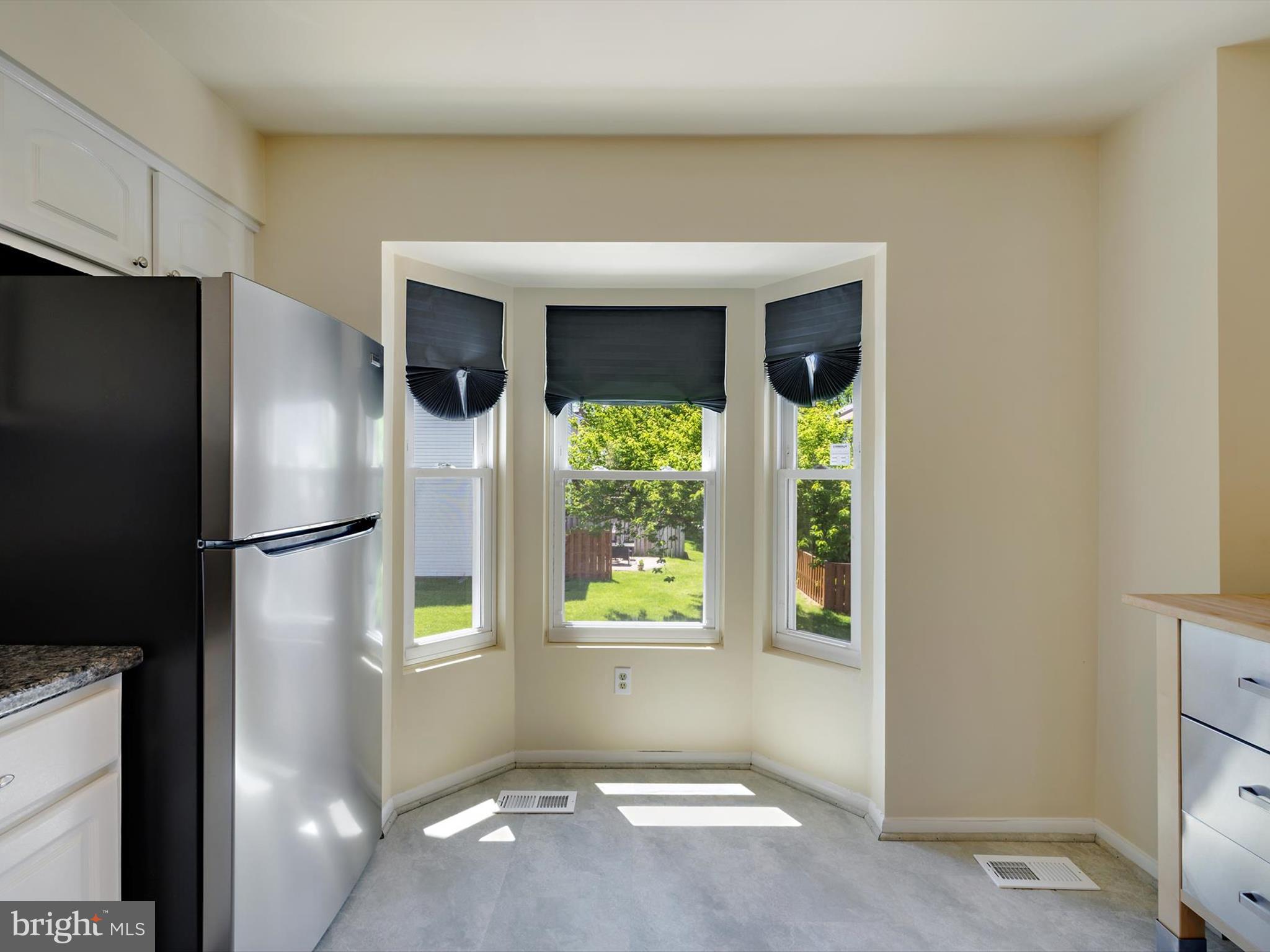 2846 Schoolhouse Circle Silver Spring, MD 20902 - Photo 12 of 32 a view of an empty room with a window