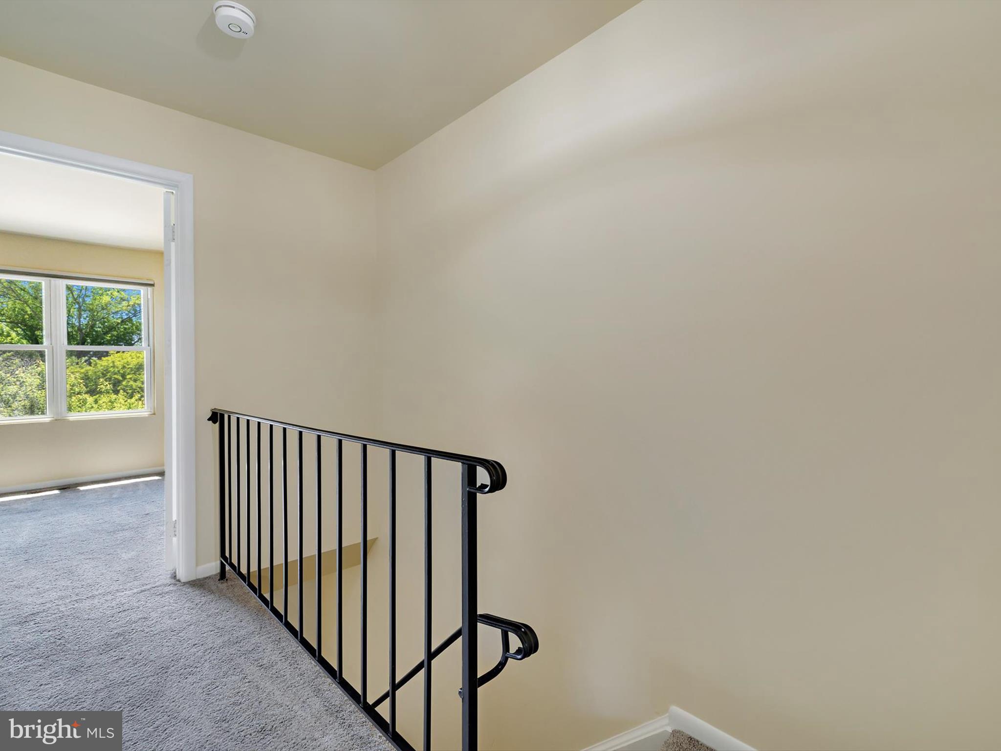 2846 Schoolhouse Circle Silver Spring, MD 20902 - Photo 15 of 32 a view of a hallway with wooden floor and a window