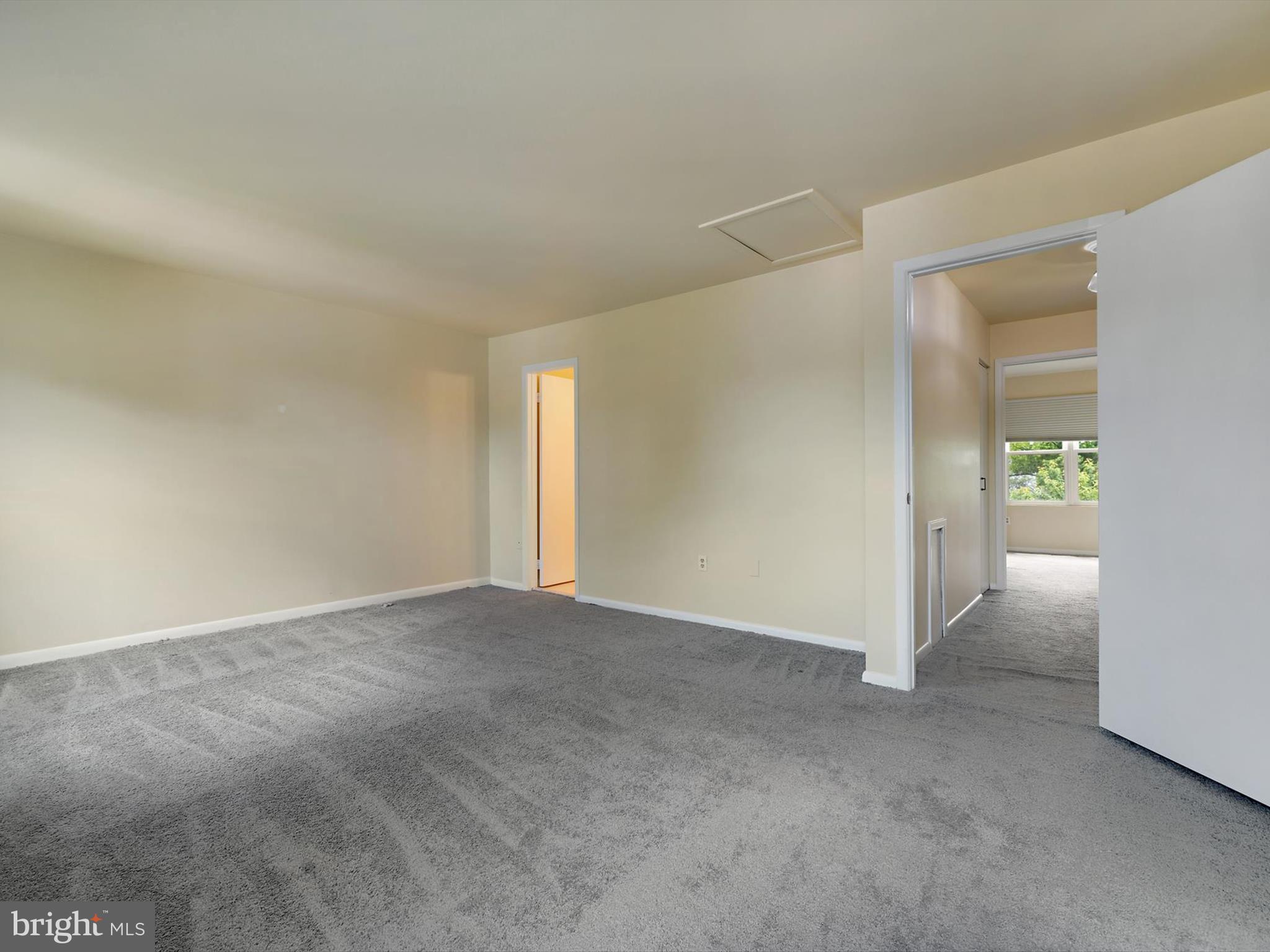 2846 Schoolhouse Circle Silver Spring, MD 20902 - Photo 17 of 32 a view of an empty room and a window