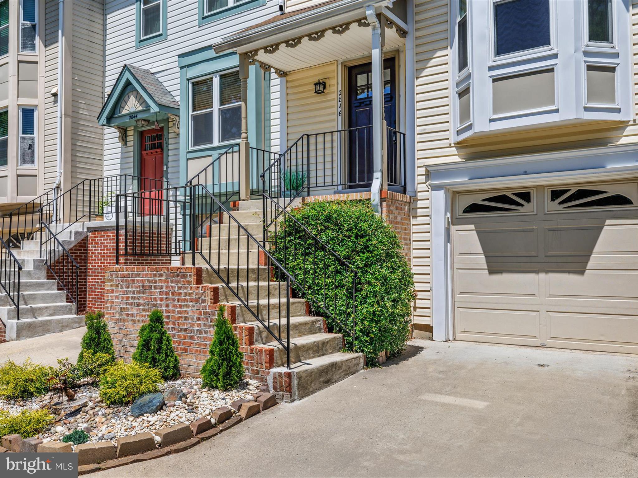2846 Schoolhouse Circle Silver Spring, MD 20902 - Photo 3 of 32 a front view of a house with a yard