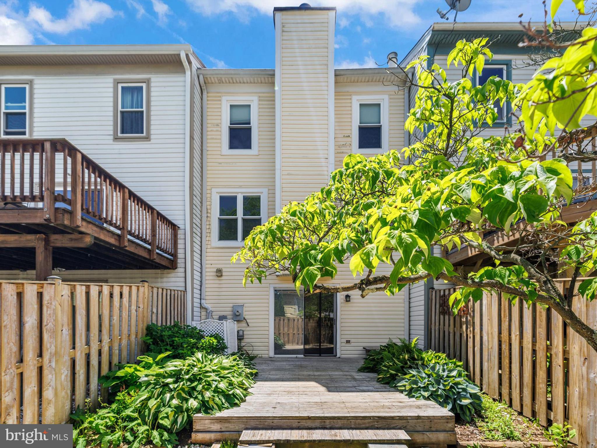 2846 Schoolhouse Circle Silver Spring, MD 20902 - Photo 31 of 32 a front view of a house with a yard