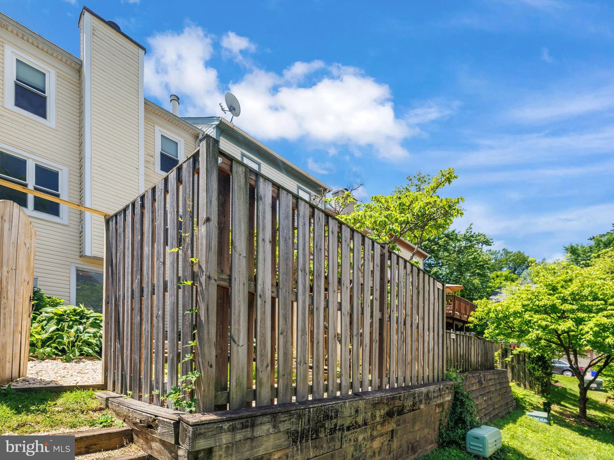 2846 Schoolhouse Circle Silver Spring, MD 20902 - Photo 32 of 32 a front view of a house with a garden