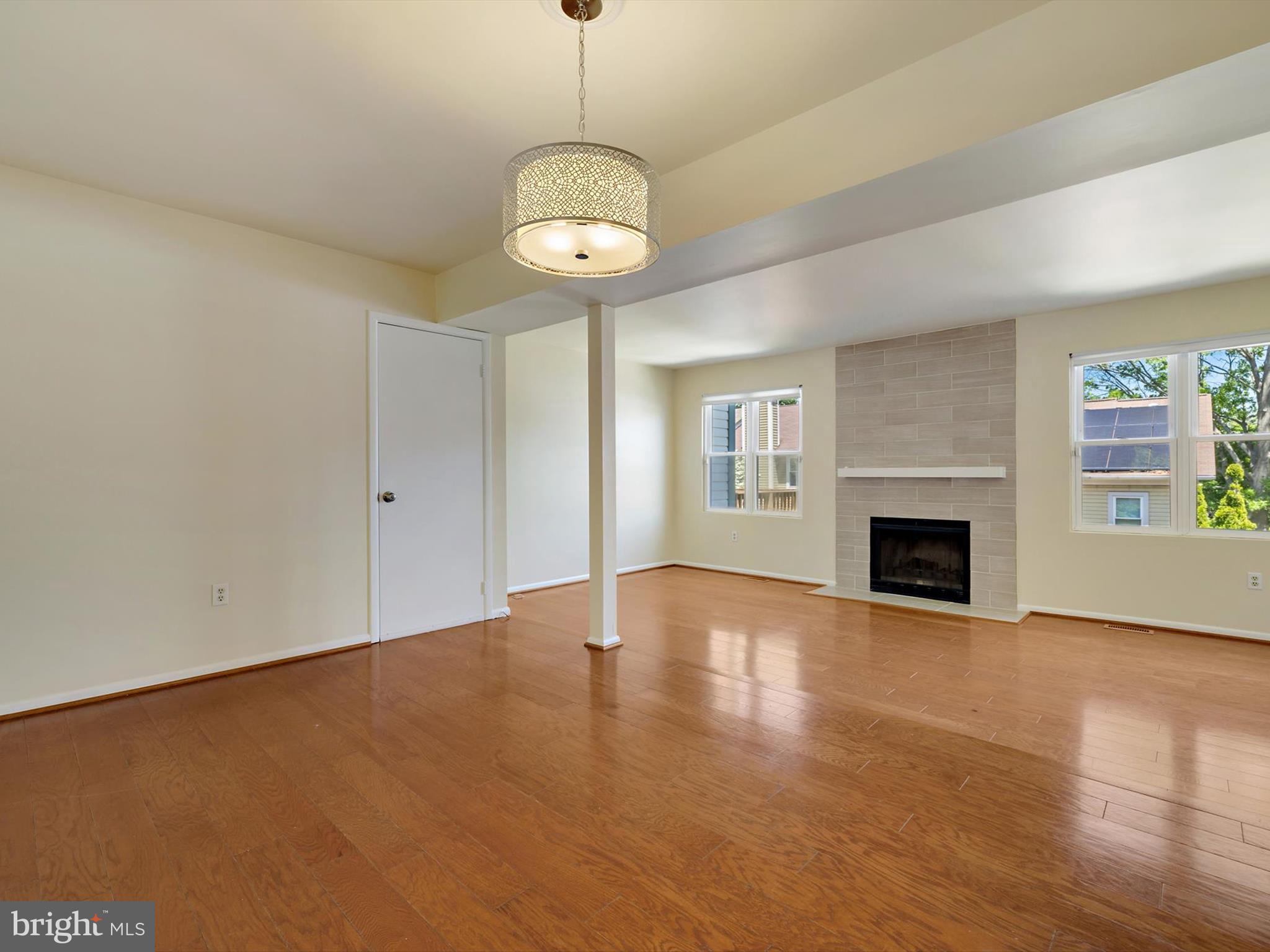 2846 Schoolhouse Circle Silver Spring, MD 20902 - Photo 6 of 32 a view of an empty room with window and fire place