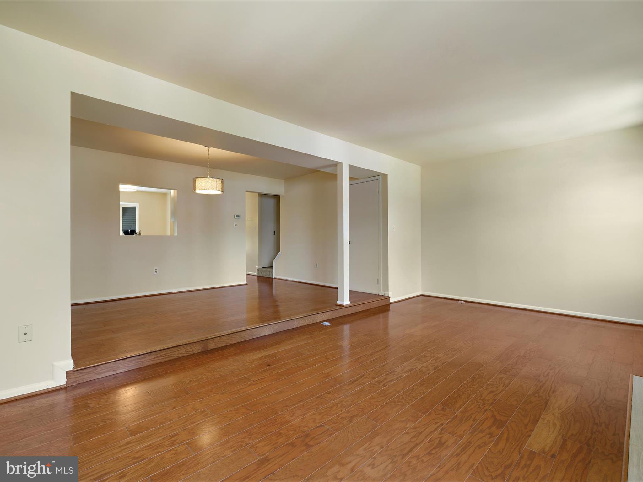 2846 Schoolhouse Circle Silver Spring, MD 20902 - Photo 7 of 32 an empty room with wooden floor and windows