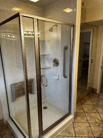a kitchen with granite countertop a stove and cabinets