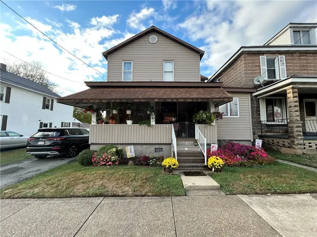 a front view of a house with garage
