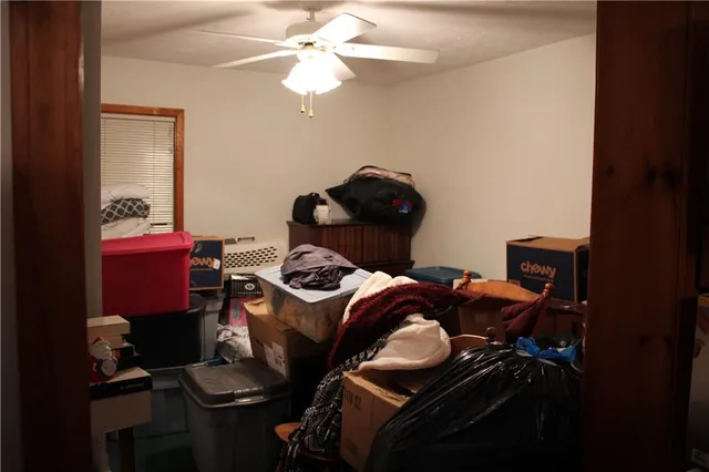 a bathroom with a toilet and a shower curtain