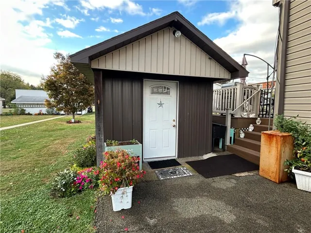 a front view of a house with garden