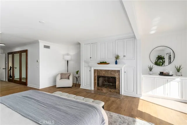 a bedroom with a bed and a fireplace