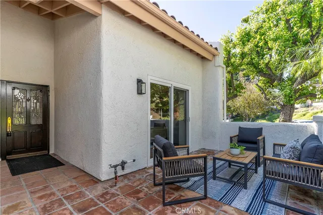a backyard of a house with outdoor seating