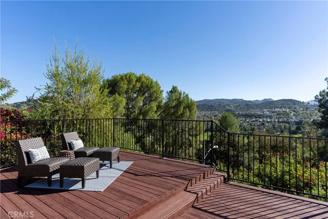 a view of a balcony with furniture