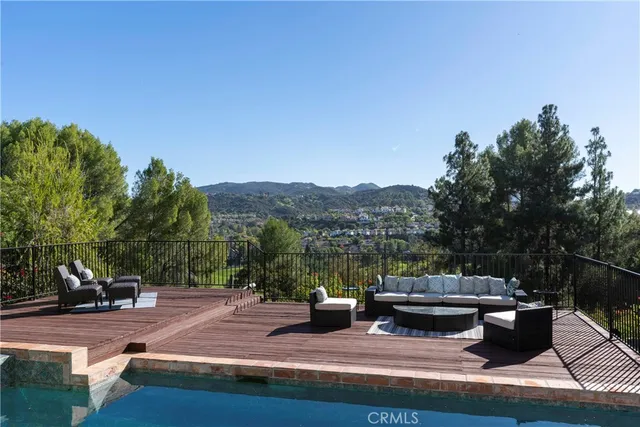 a view of a terrace with couches and a table and chairs