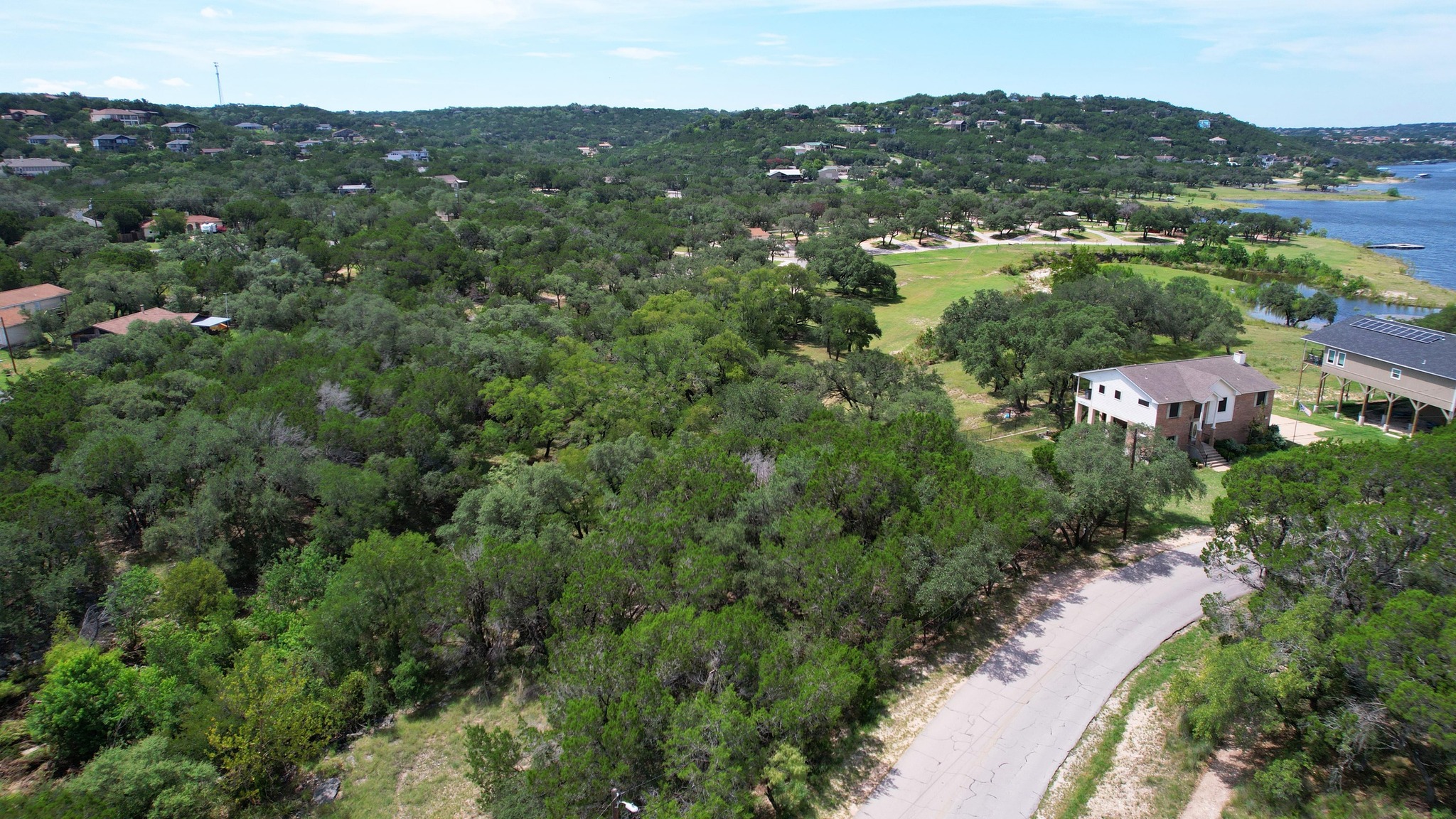 6719 Bar K Ranch Road Lago Vista, TX 78645 - Photo 4 of 36 an aerial view of residential houses with outdoor space and trees