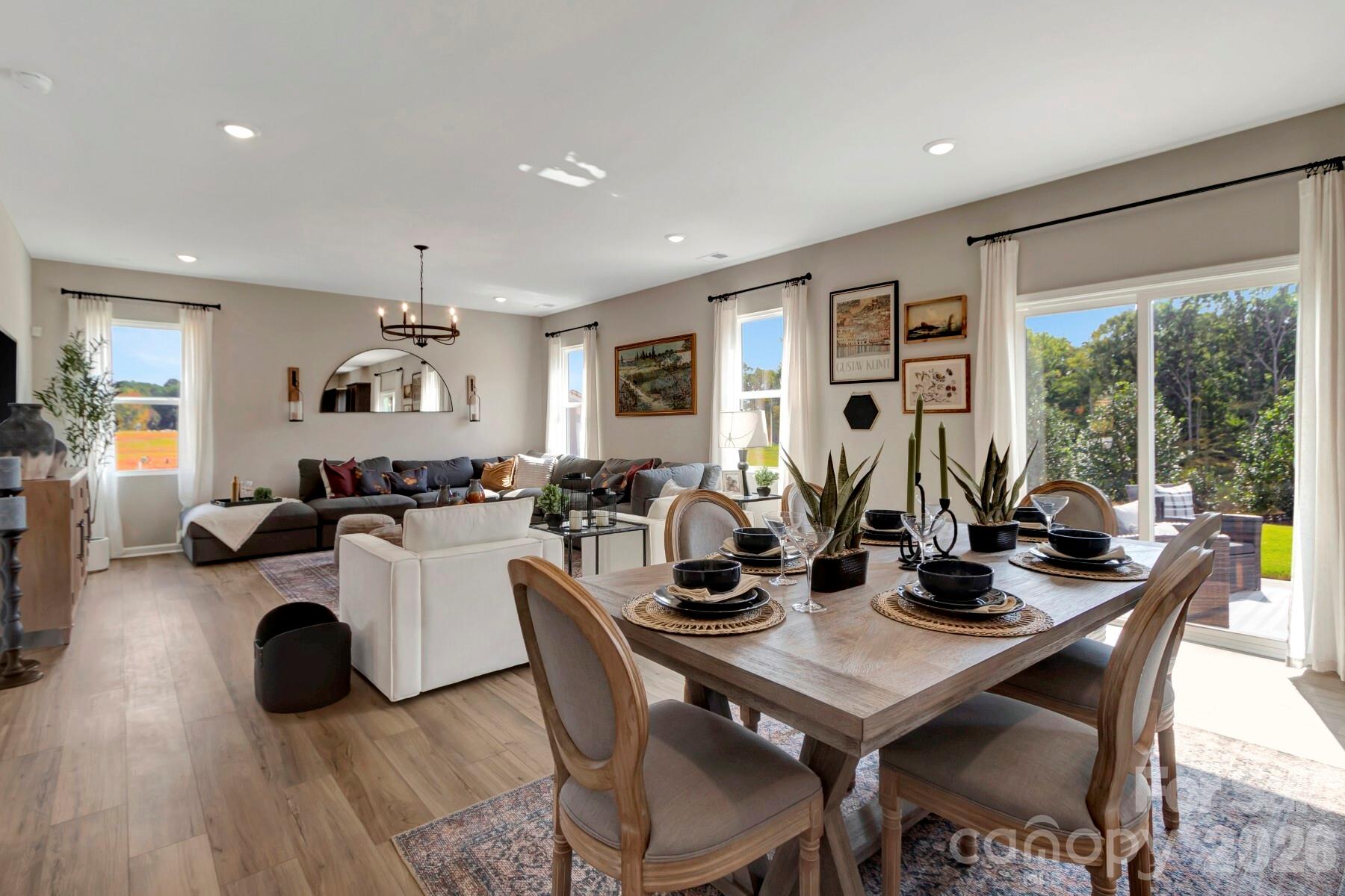 1458 Kate Cecil Way York, SC 29745 - Photo 12 of 40 a living room with furniture potted plant wooden floor and a large window