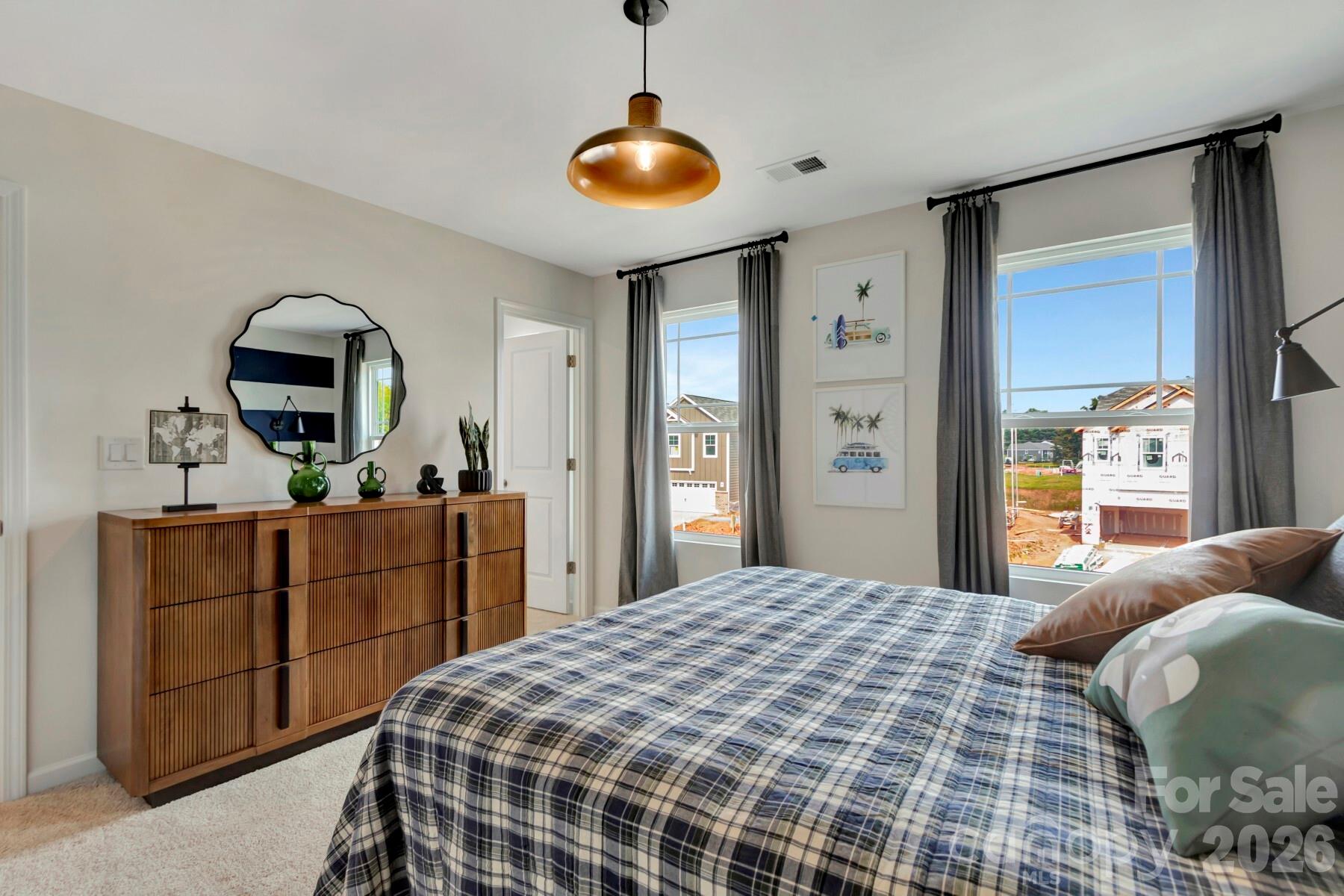 1458 Kate Cecil Way York, SC 29745 - Photo 27 of 40 a bedroom with a bed and a dresser in it