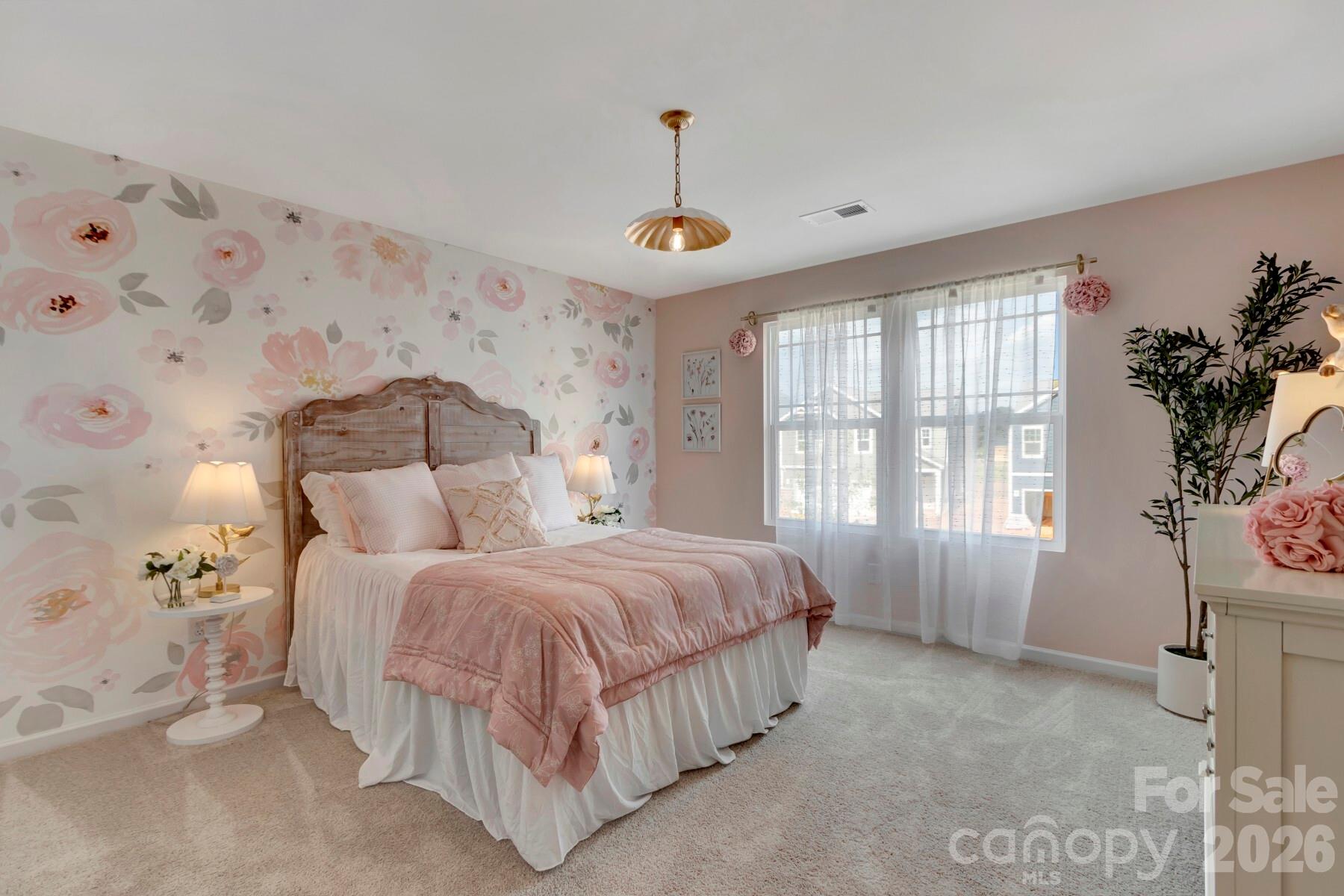 1458 Kate Cecil Way York, SC 29745 - Photo 30 of 40 a bed room with a bed and a chandelier