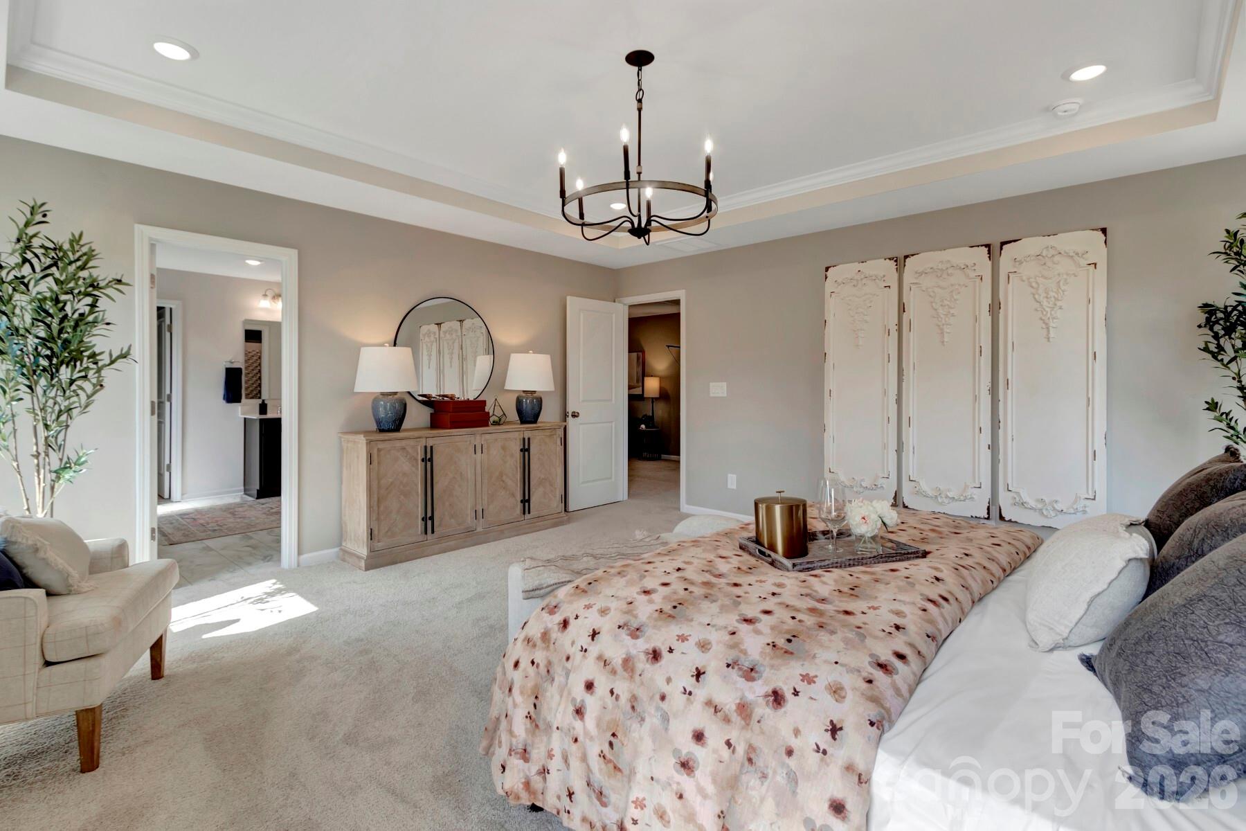 1458 Kate Cecil Way York, SC 29745 - Photo 37 of 40 a bedroom with a bed chandelier and a window