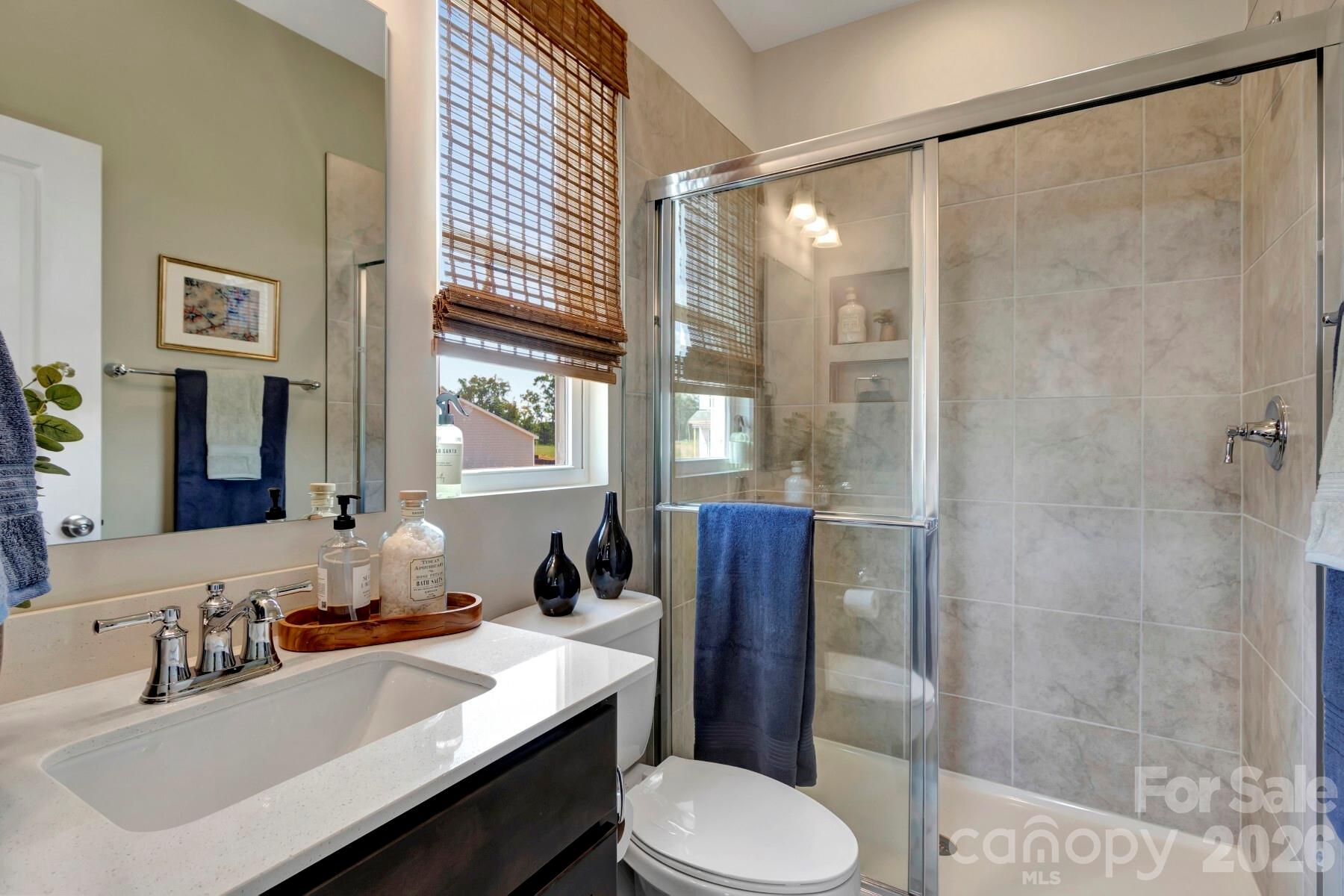 1458 Kate Cecil Way York, SC 29745 - Photo 7 of 40 a bathroom with a sink toilet and shower