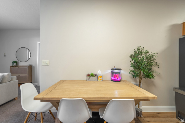 700 North Main Street, Unit F3 Washington, UT 84780 - Photo 12 of 34 Dining area featuring wood-finish flooring and a neutral color palette