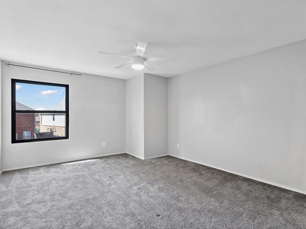 5304 Los Altos Road Fort Worth, TX 76244 - Photo 27 of 30 Carpeted empty room with a ceiling fan and baseboards