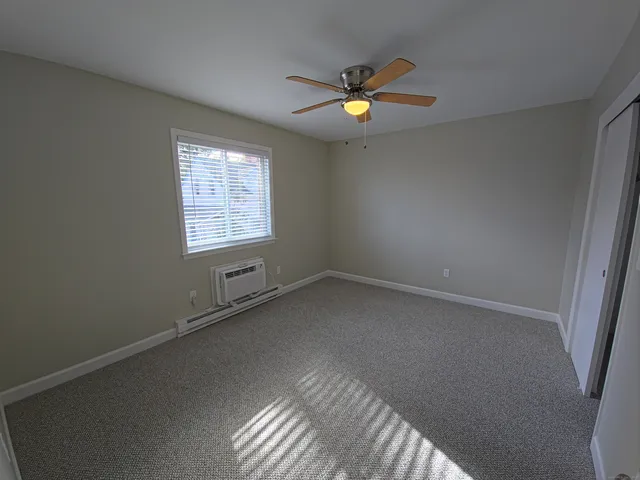 a view of an empty room and window