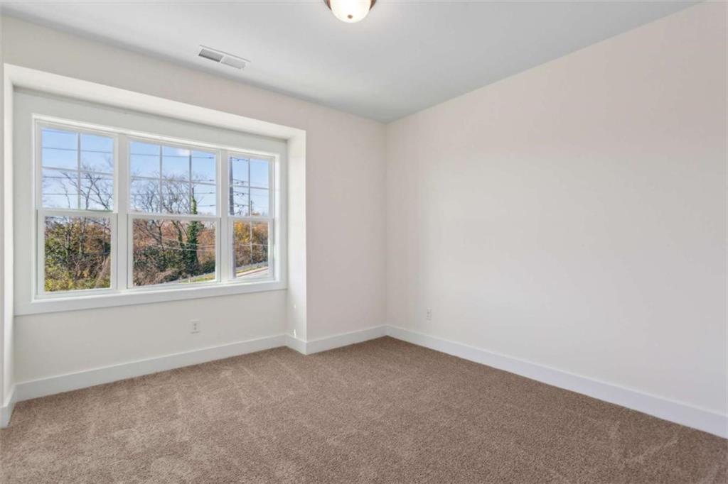 103 Mission Way Atlanta, GA 30315 - Photo 3 of 18 an empty room with a window