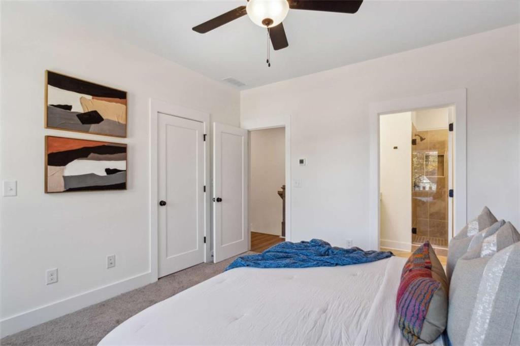 103 Mission Way Atlanta, GA 30315 - Photo 7 of 18 a bedroom with a bed and a chandelier