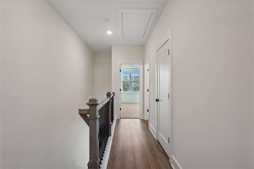 103 Mission Way Atlanta, GA 30315 - Photo 10 of 18 a view of a hallway with wooden floor and a bathroom