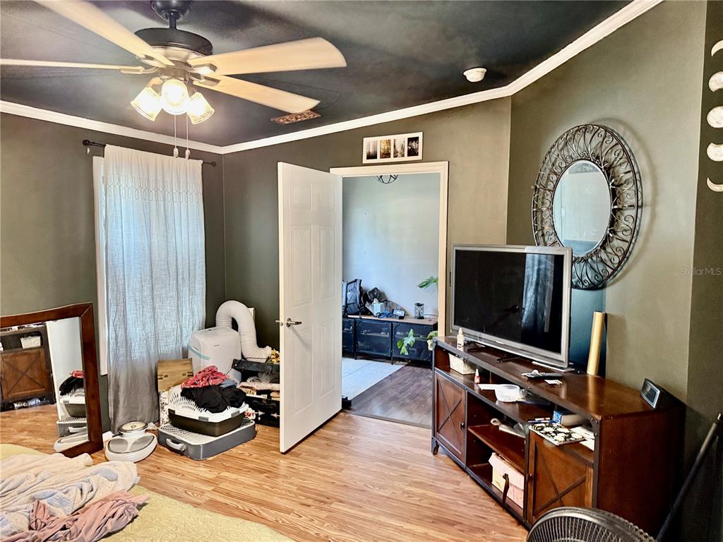 5321 South June Terrace, Unit 74 Homosassa, FL 34446 - Photo 11 of 28 a living room with furniture and a flat screen tv