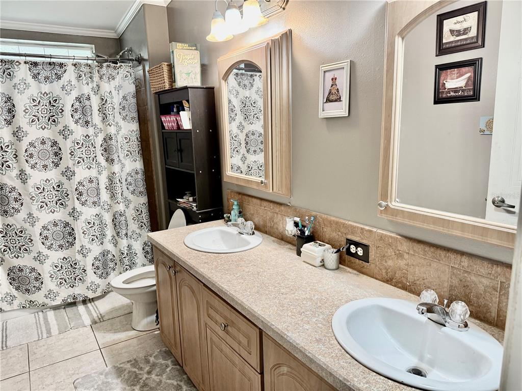 5321 South June Terrace, Unit 74 Homosassa, FL 34446 - Photo 19 of 28 a bathroom with a sink and a mirror